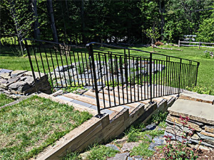 Railings on wood and stone steps