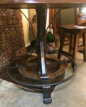 Mahogany table with belt pulley base from an old wood mill